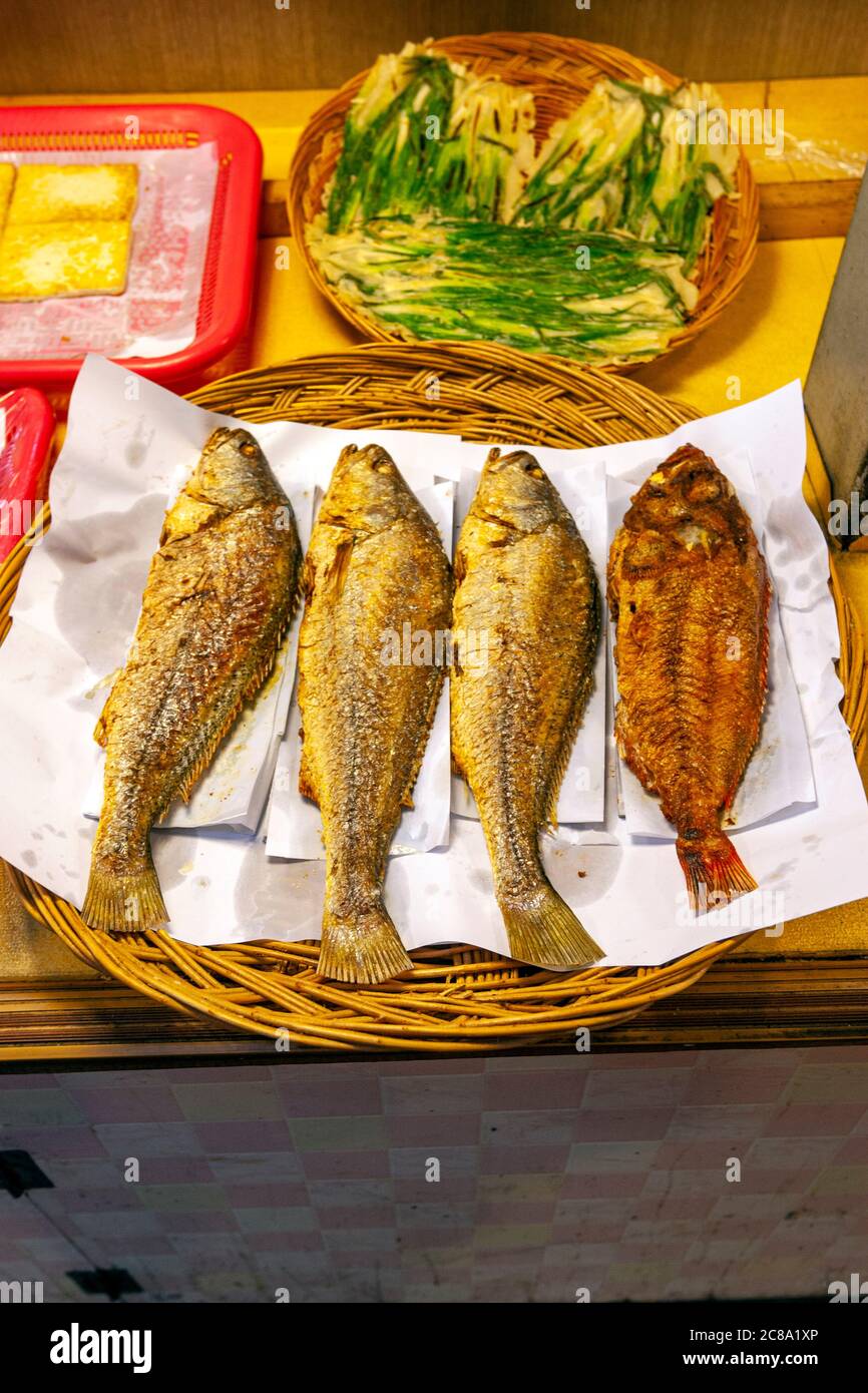 Counter with prepared fish dishes in Traditional Seongdong market