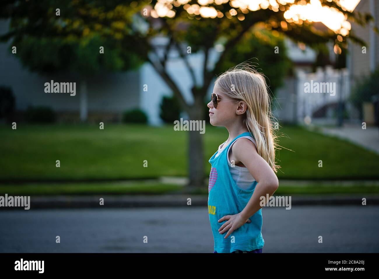 Portrait of blonde young girl in power pose Stock Photo Alamy