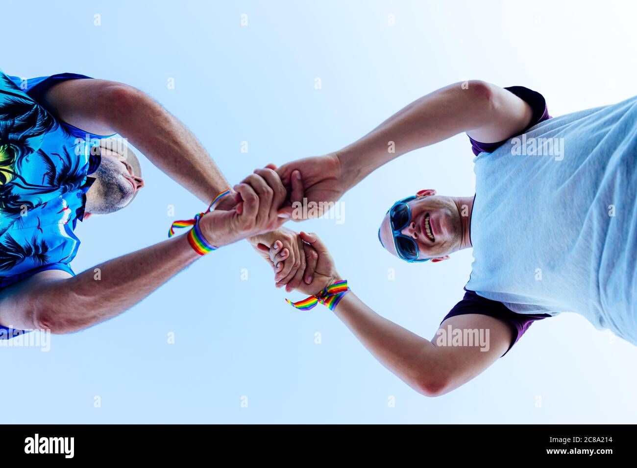 Young gay men holding hands hi-res stock photography and images - Alamy