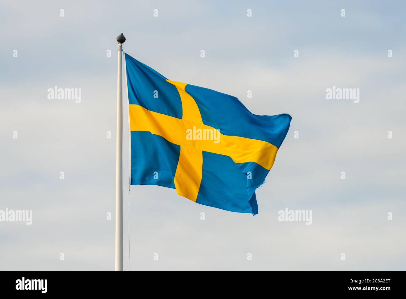 Large swedish flag waving in the breeze.. Stock Photo