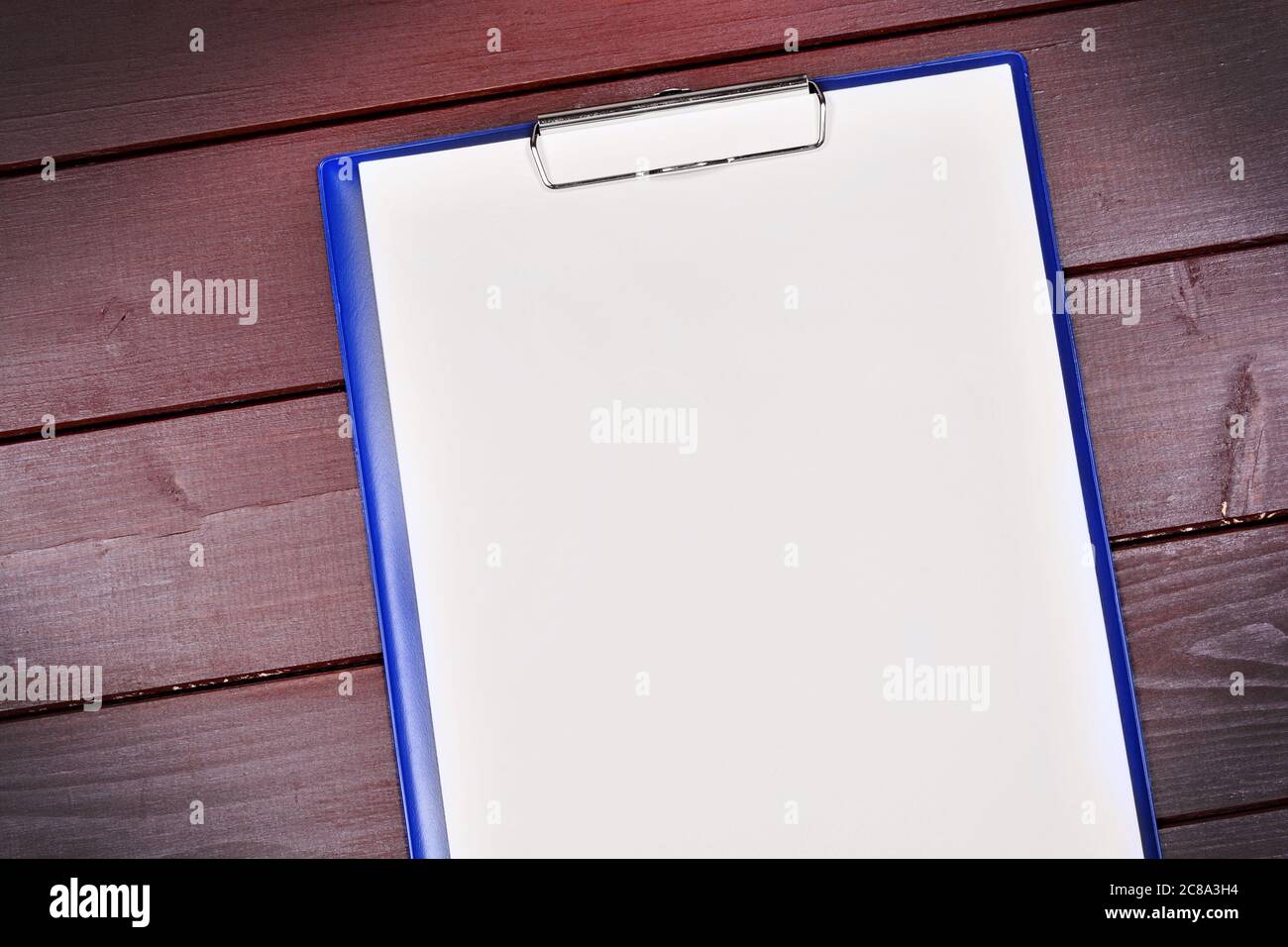 Close up of empty clipboard on a wood table Stock Photo