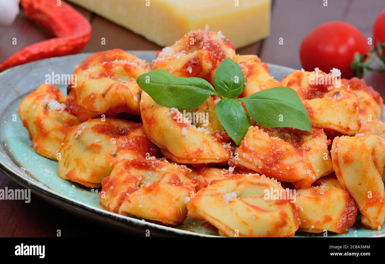 Close up of tortellini with tomatoes sauce in a plate Stock Photo