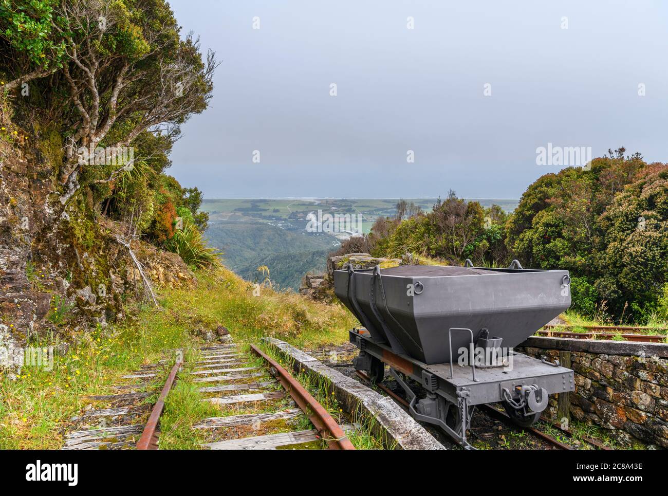 View down the Denniston Incline gravity raiiway in the abandoned coal minding town of Denniston, West Coast, South Island, New Zealand Stock Photo