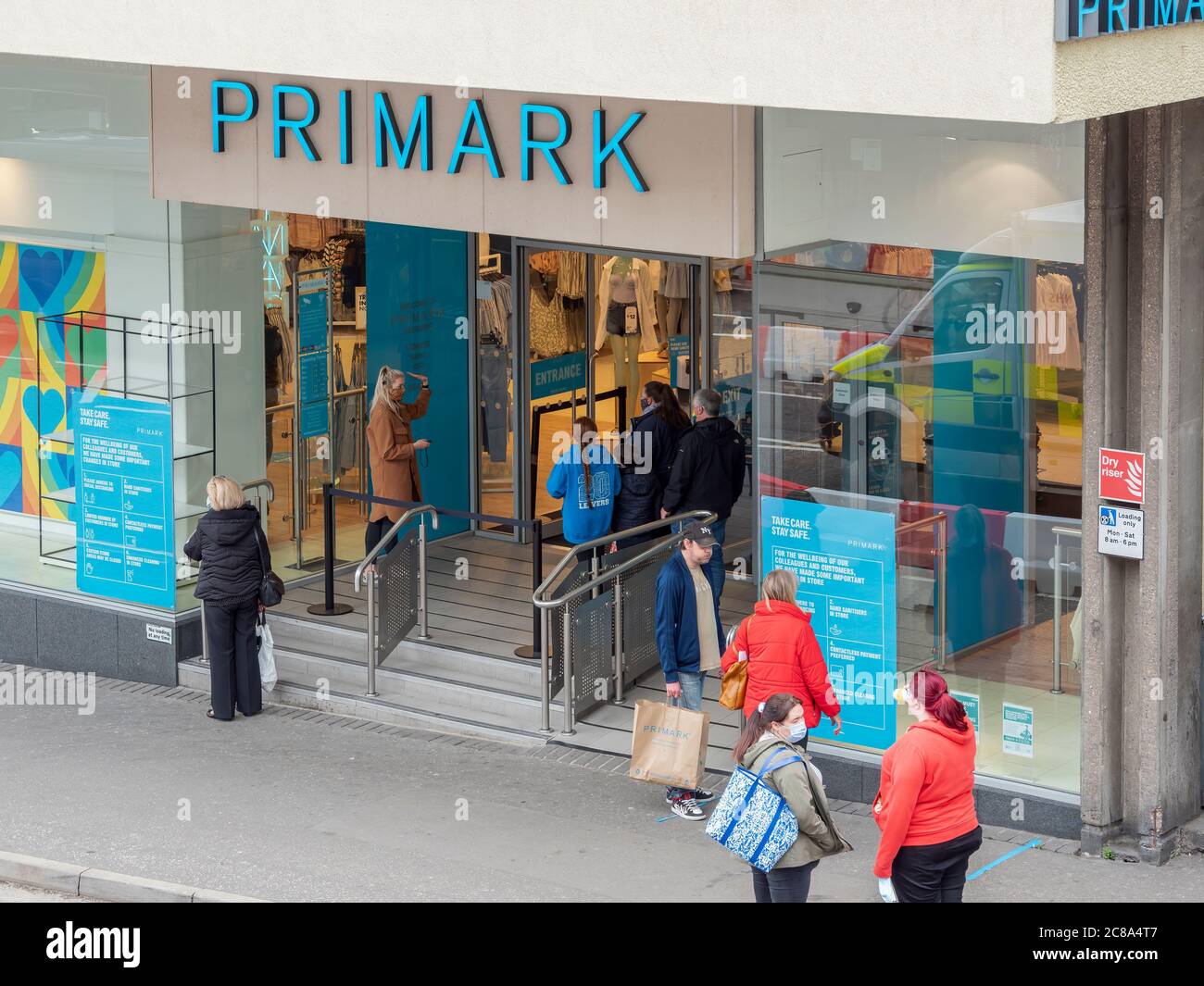 Inverness, Highland, Scotland, 14th July 2020. Primark customers being briefed on social distancing measures before entering Bridge Street store. Stock Photo