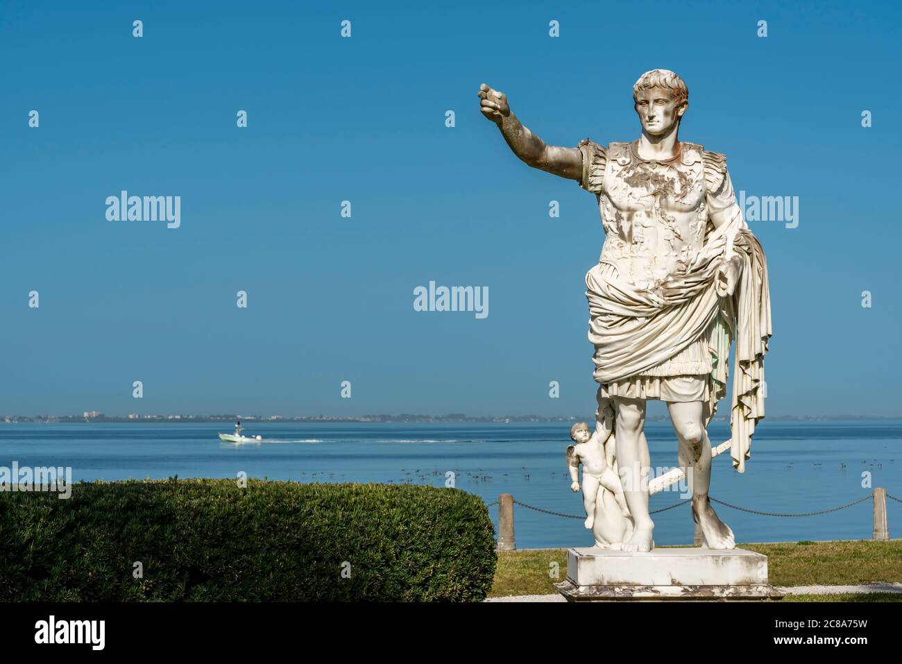 Ancient roman statue decorating garden in front of the sea Stock Photo