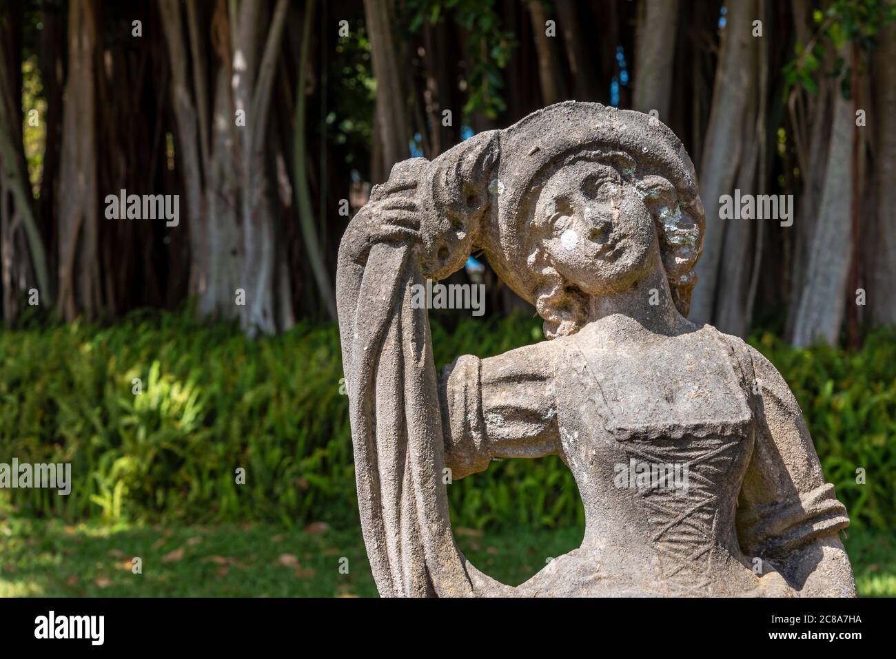 Closeup on decorative statue of young girl in a garden in Florida