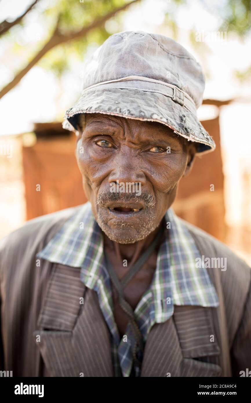 Portrait of an elderly man, aged 81, in front of hishouse in Makueni County, Kenya, East Africa. Stock Photo