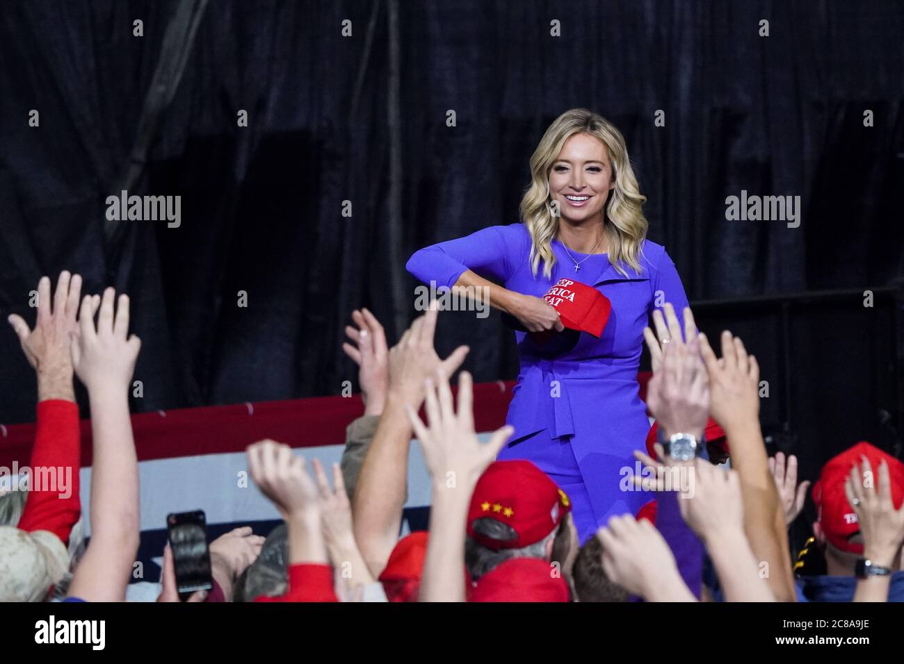 White House Press Secretary Kayleigh McEnany throws MAGA hats to the crowd at the Keep America Great Rally at the in the North Charleston Coliseum February 28 2020 in North Charleston, South Carolina. Stock Photo