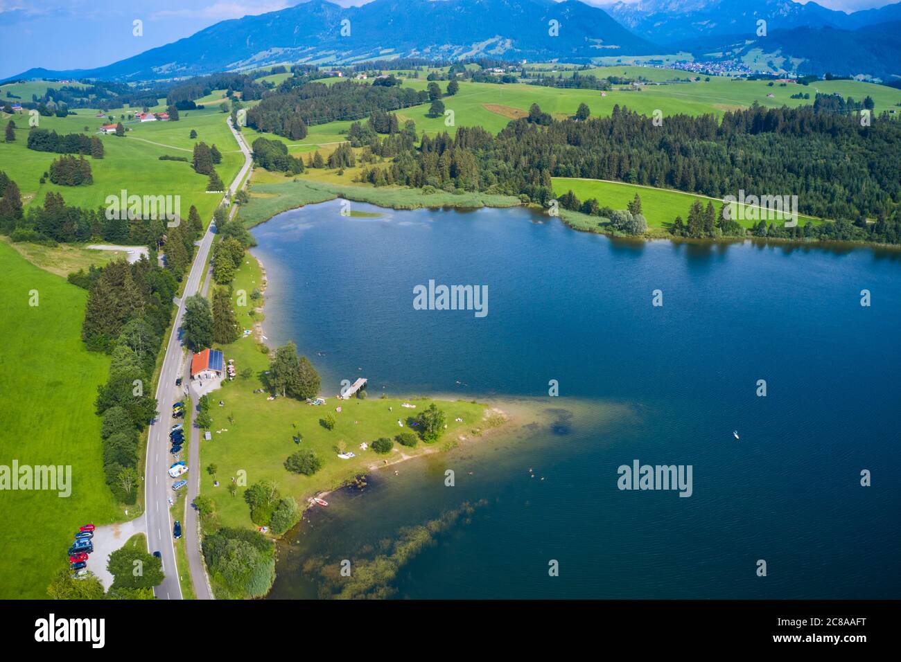 Fuessen, Germany, July 22, 2020.  Tourists swimming and relaxing at lake Illasbergsee near Forggensee  © Peter Schatz / Alamy Live News Stock Photo