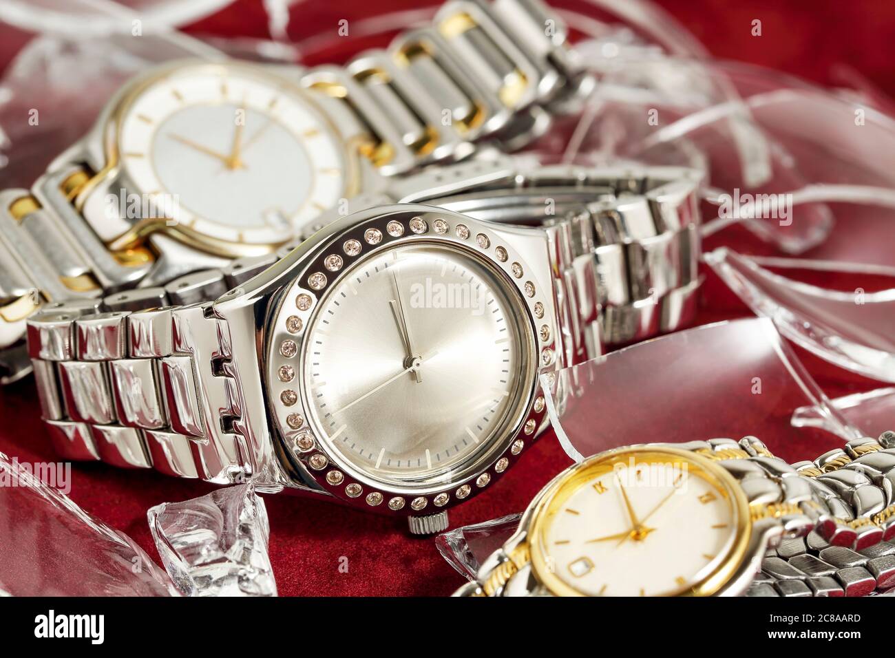 glamorous watches with pieces of broken glass Stock Photo - Alamy