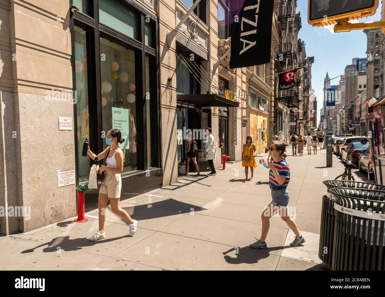 Shoppers in the Soho neighborhood of New York on Sunday, July 12, 2020. As part of the Phase 3 reopening in New York stores are allowed in-store shopping with restrictions. (© Richard B. Levine) Stock Photo
