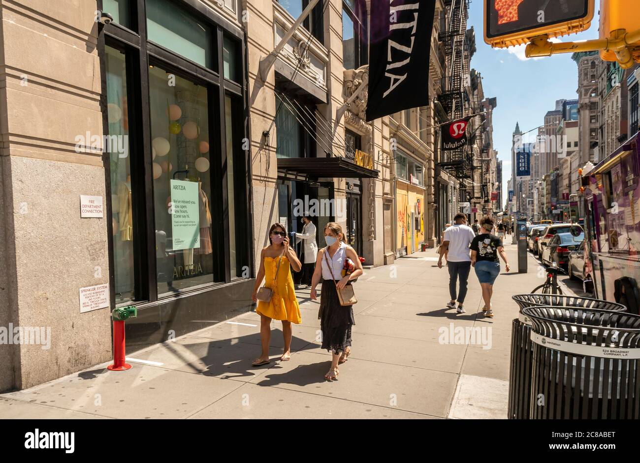Shoppers in the Soho neighborhood of New York on Sunday, July 12, 2020. As part of the Phase 3 reopening in New York stores are allowed in-store shopping with restrictions. (© Richard B. Levine) Stock Photo