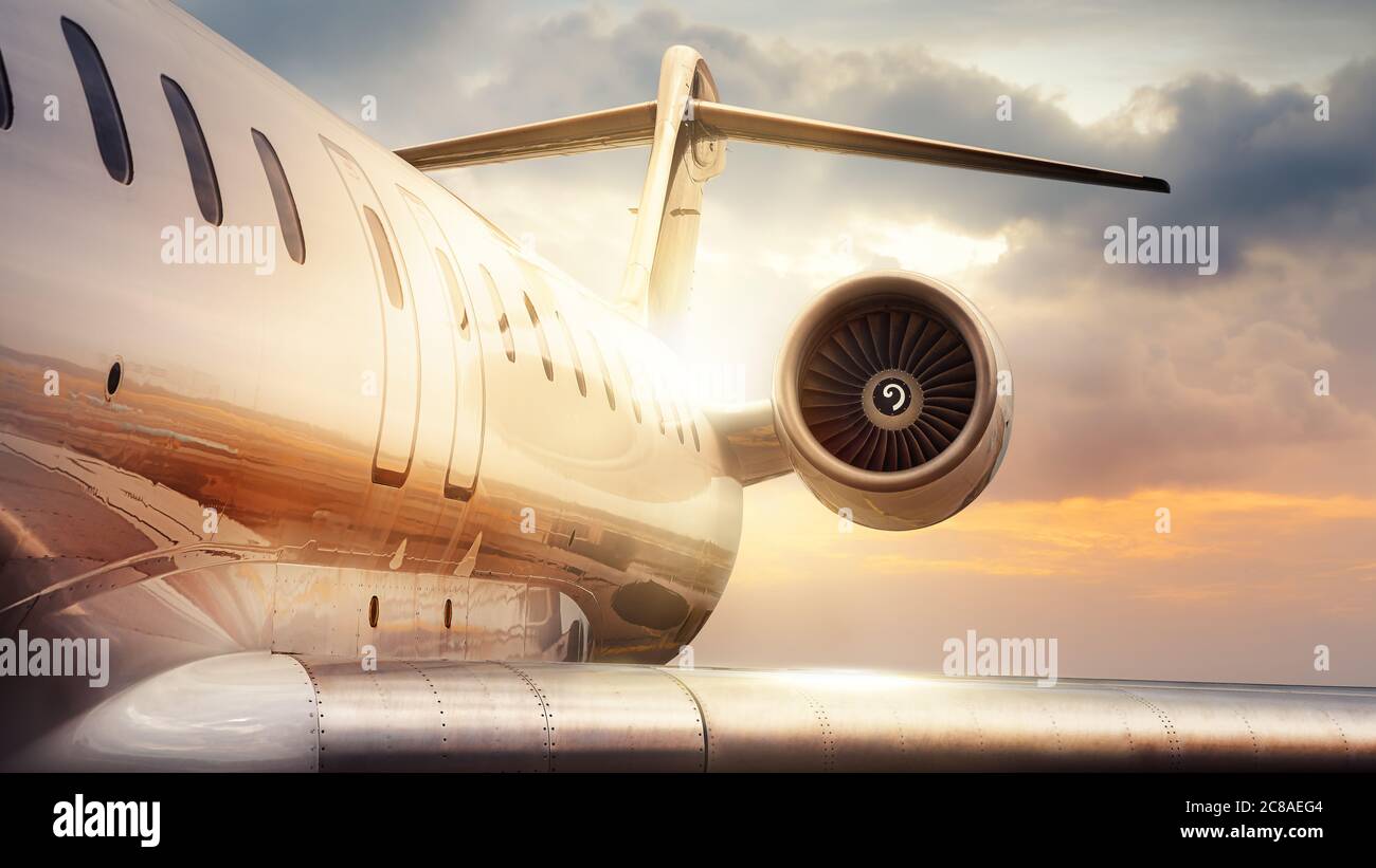 private jet against a sunset Stock Photo