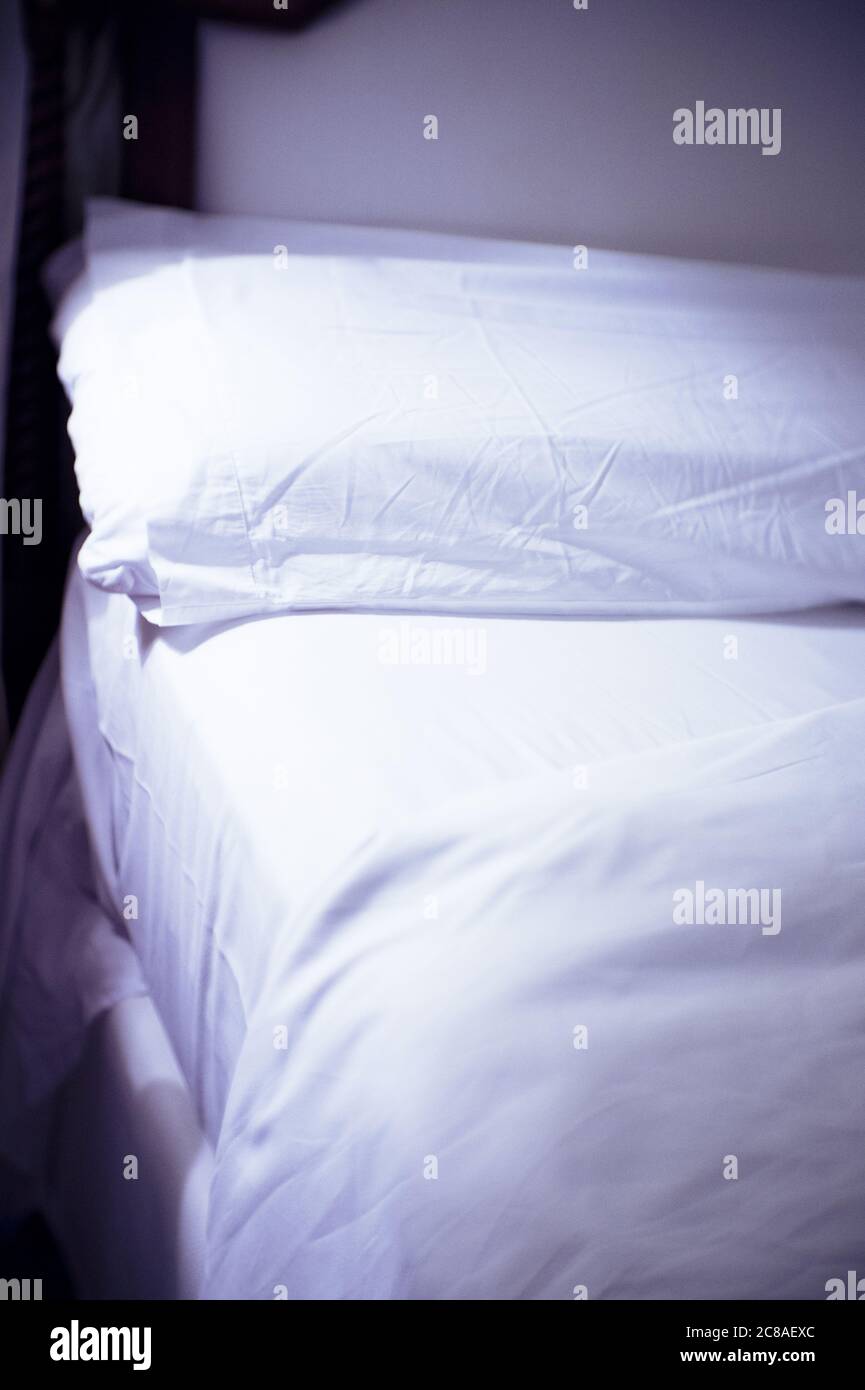 Open bed with bed sheets off. No people Stock Photo Alamy