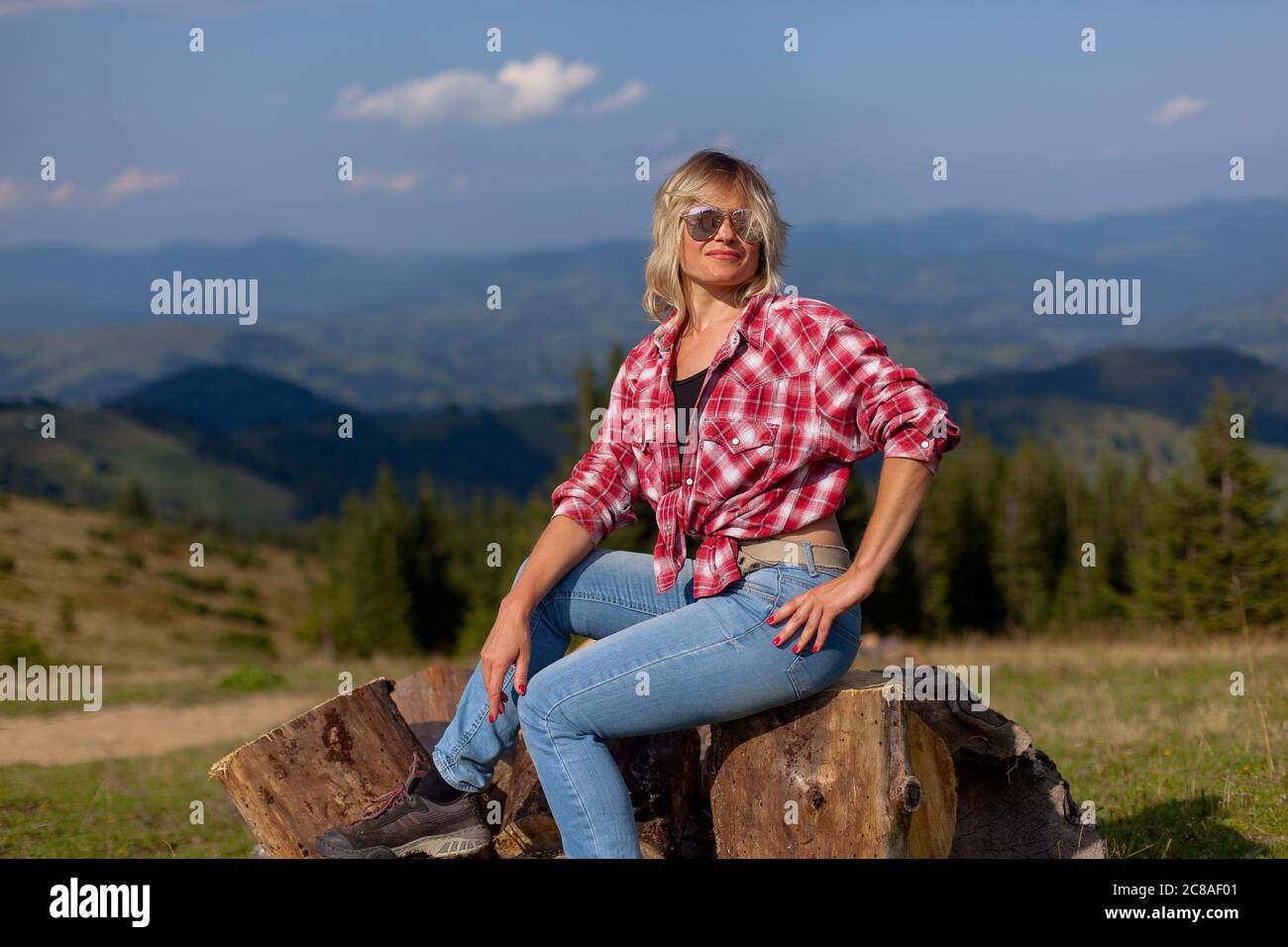 Girl in checkered shirt sits hi-res stock photography and images - Alamy