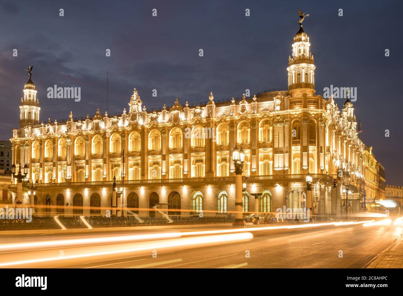 The Great Theater of Havana, home of the Cuban National Ballet, illuminated at night with traffic light trails Stock Photo