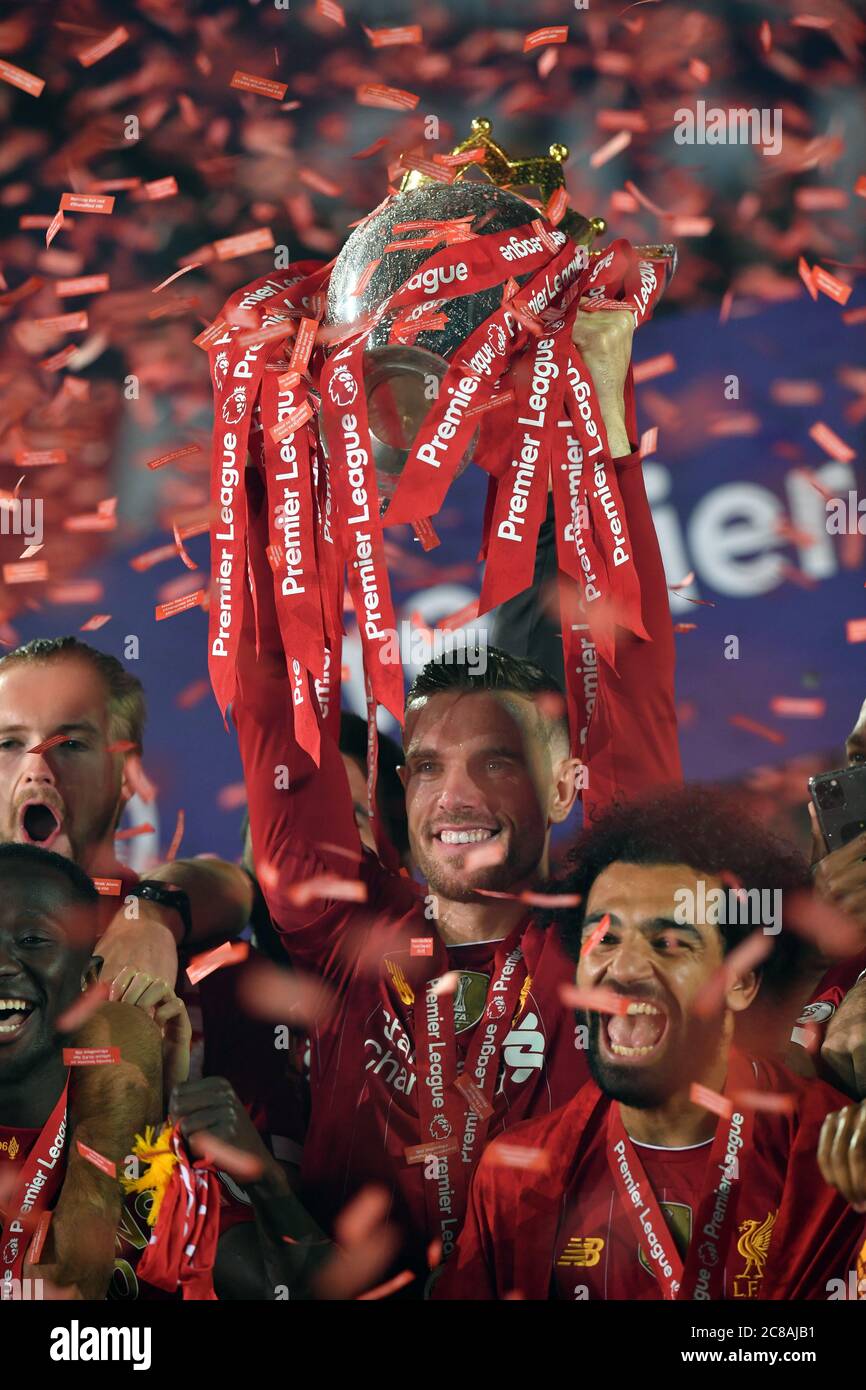 Liverpool captain Jordan Henderson lifts the Premier League Trophy  following the Premier League match at Anfield, Liverpool Stock Photo - Alamy