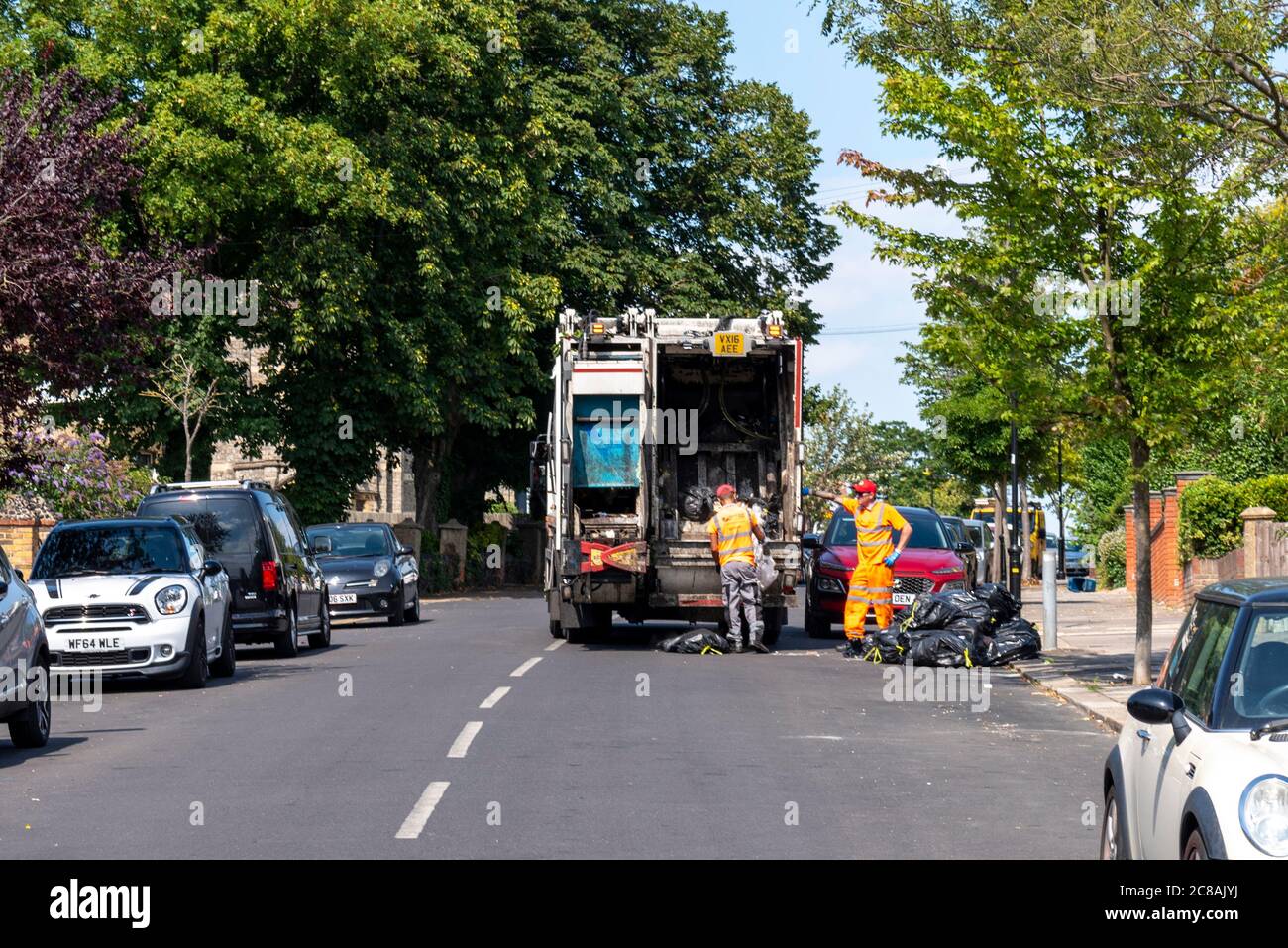 Southend on Sea Borough Council refuse truck in Westcliff on Sea, Southend, Essex, UK. Veolia Environmental Services. Dropped mess on road. Bin bags Stock Photo