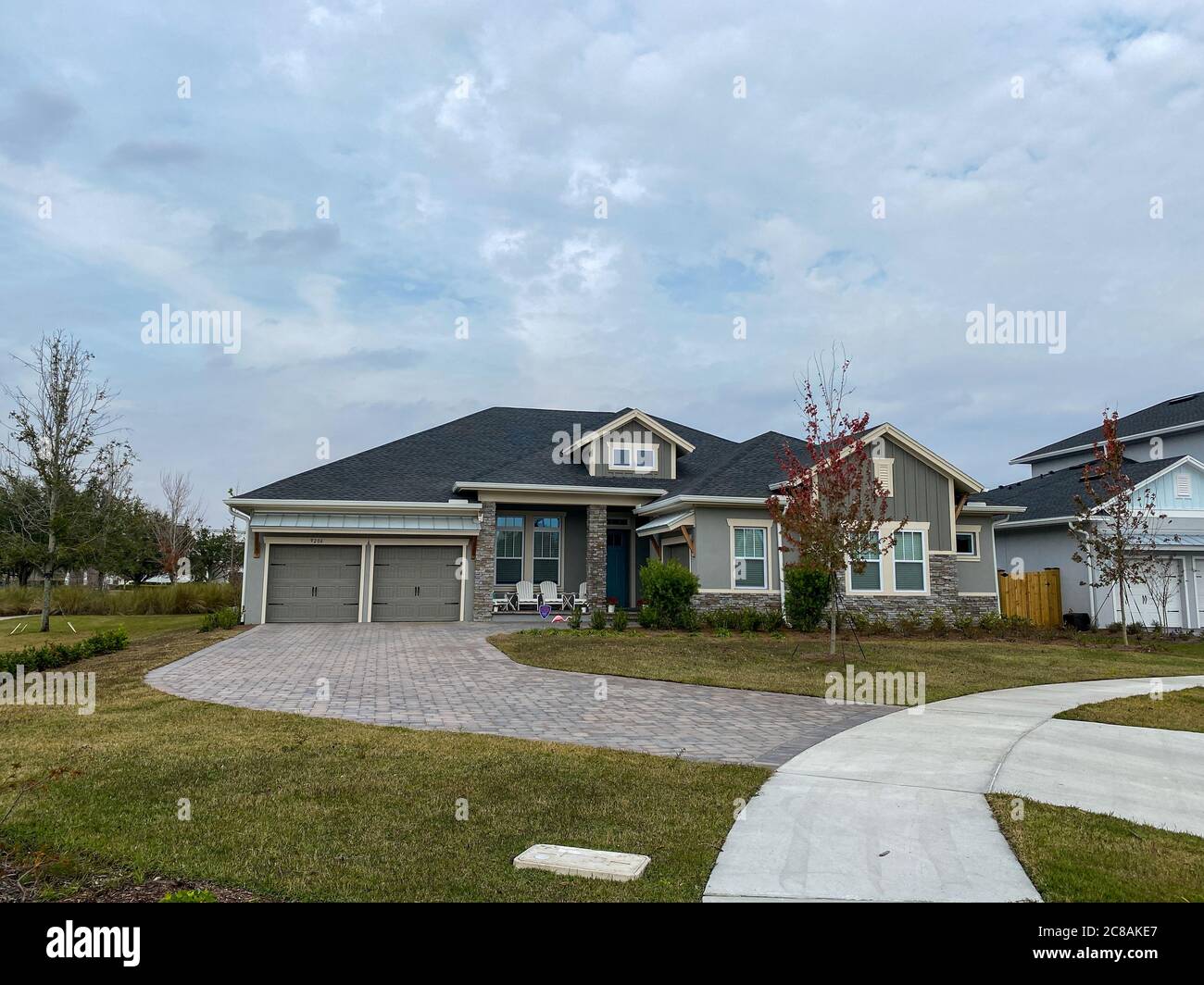 A luxury gray house in the Laureate Park neighborhood in Lake Nona
