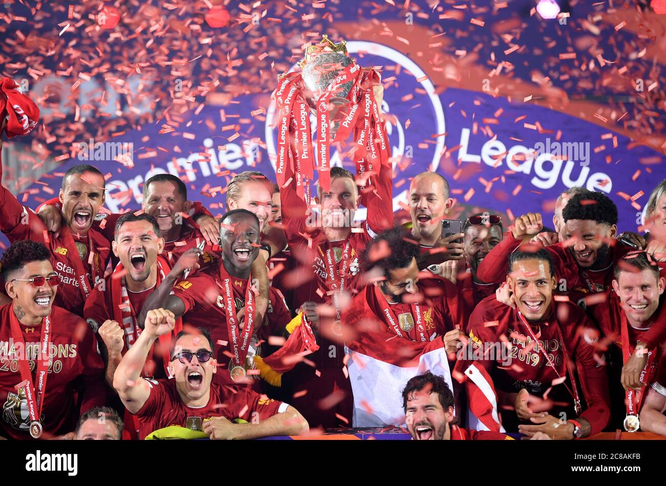 Liverpool's Jordan Henderson lifts the English Premier League trophy during the Premier League match at Anfield, Liverpool. Stock Photo