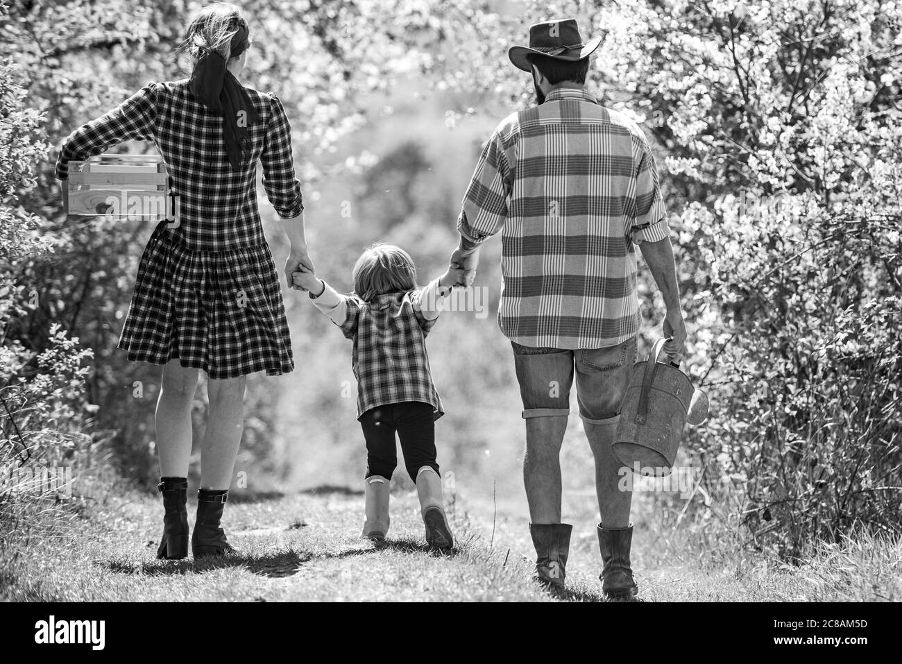 Happy family: mother, father, children son on spring garden background ...