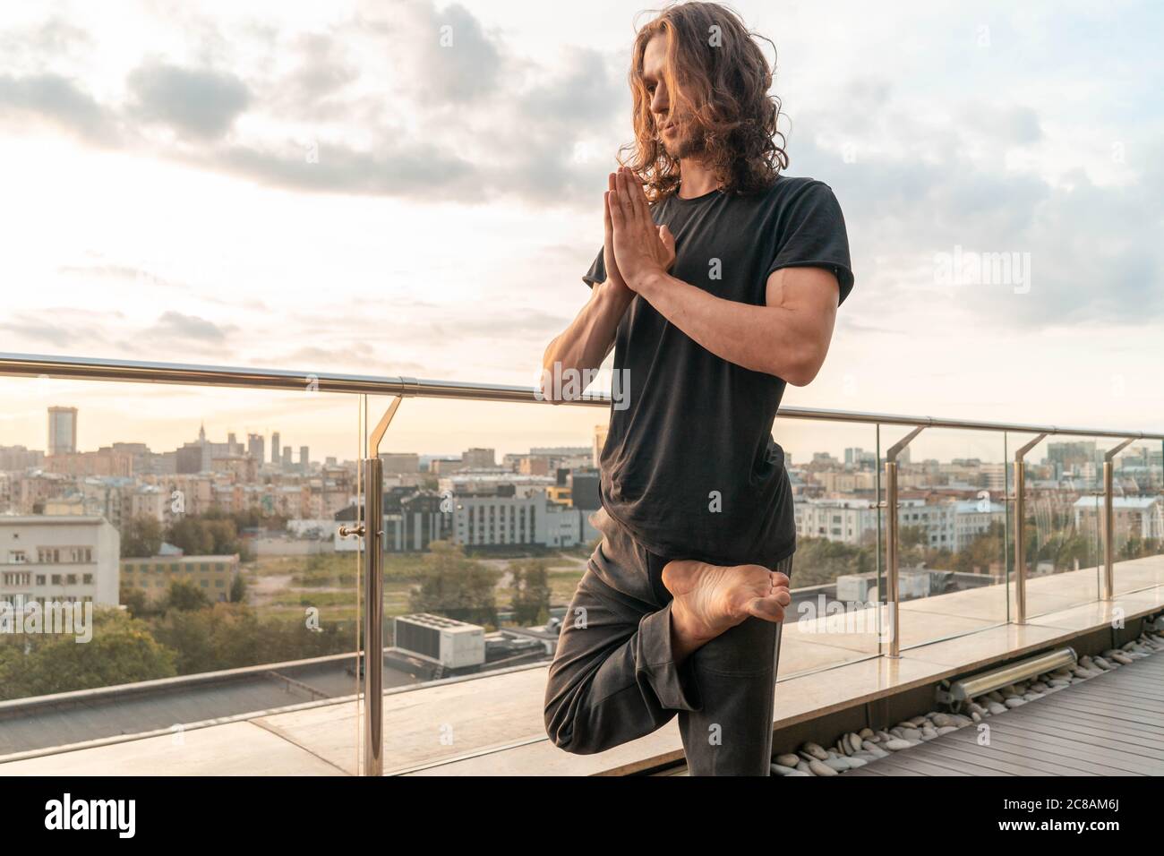 Yoga pose with cityscape background hi-res stock photography and images ...