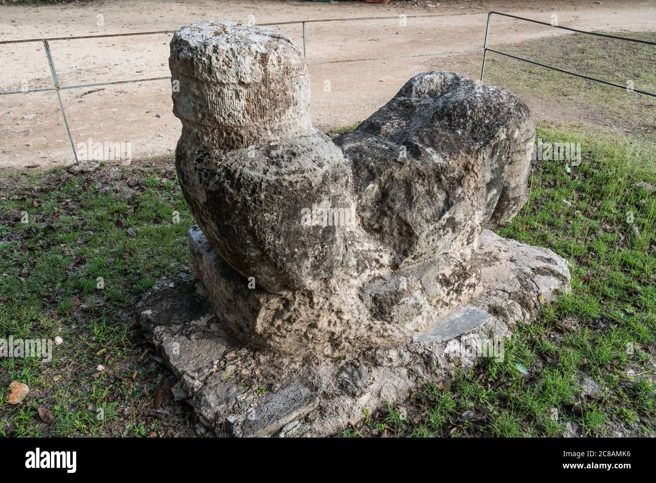 A statue of Chac Mool by the Platform of the Eagles and Jaguars in the ruins of the great  Mayan city of Chichen Itza, Yucatan, Mexico.  The Pre-Hispa Stock Photo