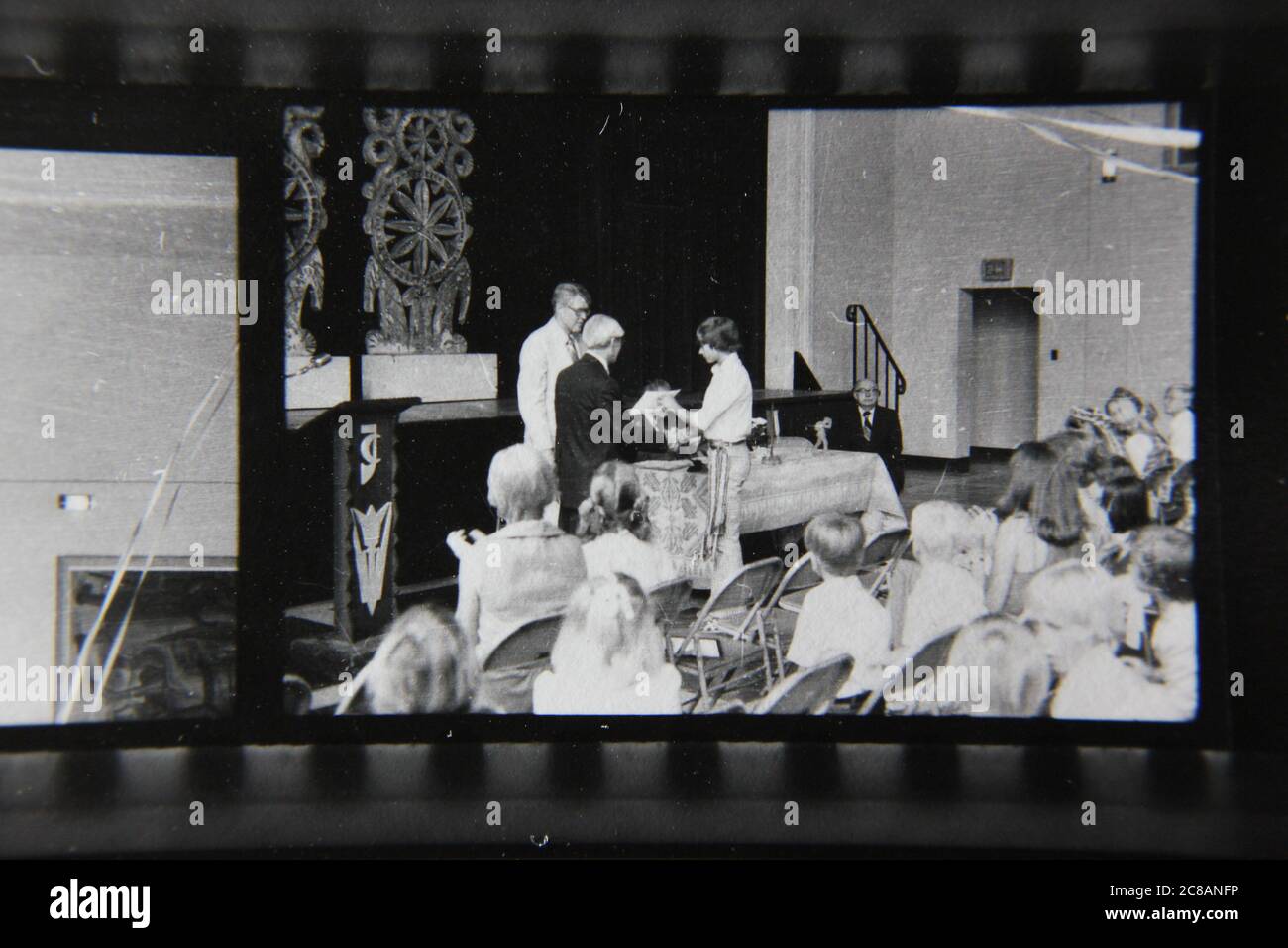 Fine 70s vintage contact print black and white photography of an awards presentation ceremony. Stock Photo