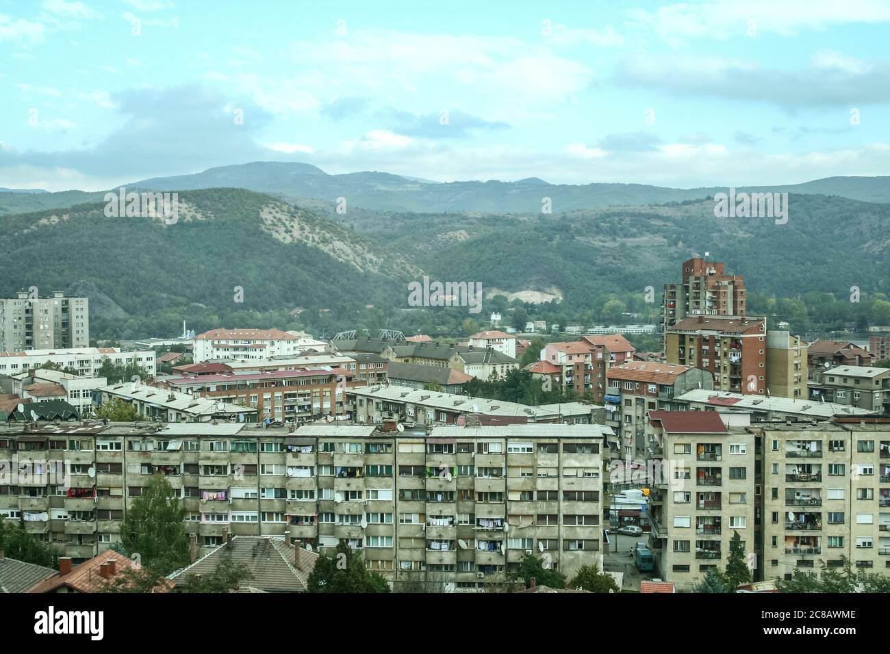 panorama of North Mitrovica, the serbian part of the town, with crumbling residential buildings, It is a symbol of the division between albanians and Stock Photo