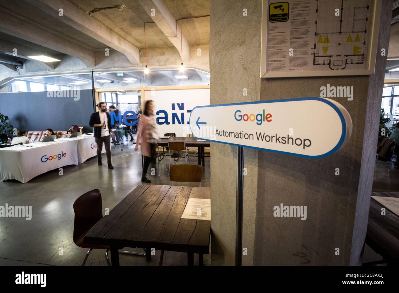 BUCHAREST, ROMANIA - FEBRUARY 12, 2020: Google logo on entrance of a workshop on automated bidding. Google Partners is a program between Google & mark Stock Photo