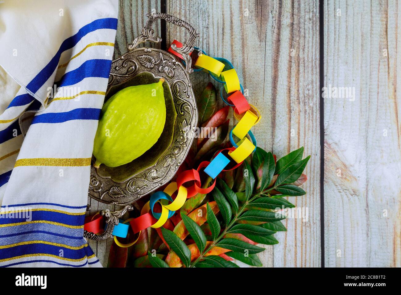Religious Jews of Sukkot choose etrog fruit of traditional fair of ritual plants on the eve Stock Photo