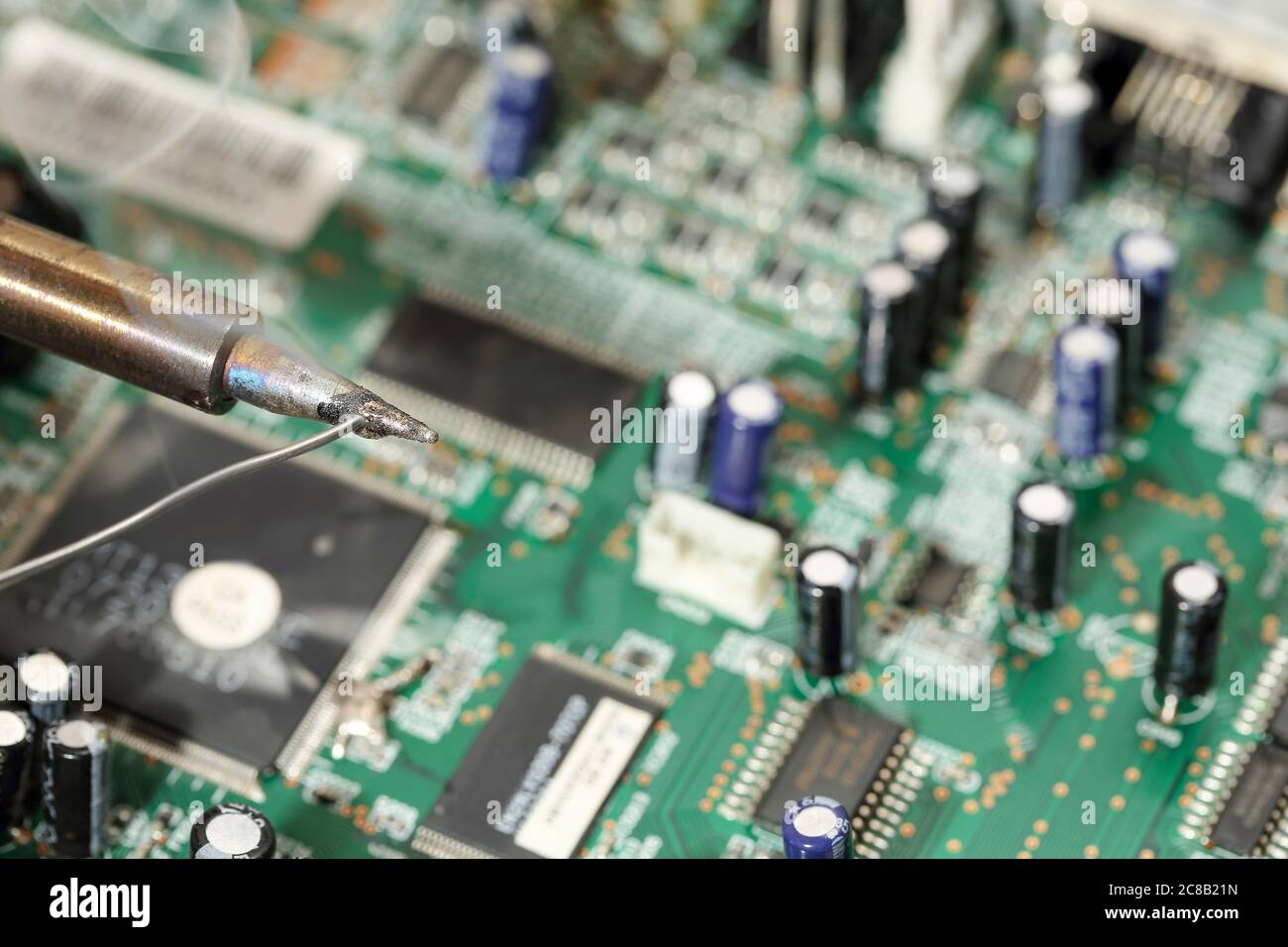 melting solder wire on soldering iron tip closeup Stock Photo Alamy