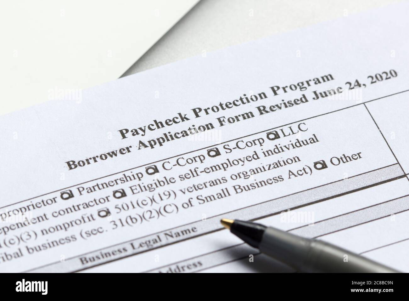 The Paycheck Protection Program (PPP) Borrower Application Form. PPP loan provides an incentive for small businesses to keep their workers on payroll. Stock Photo