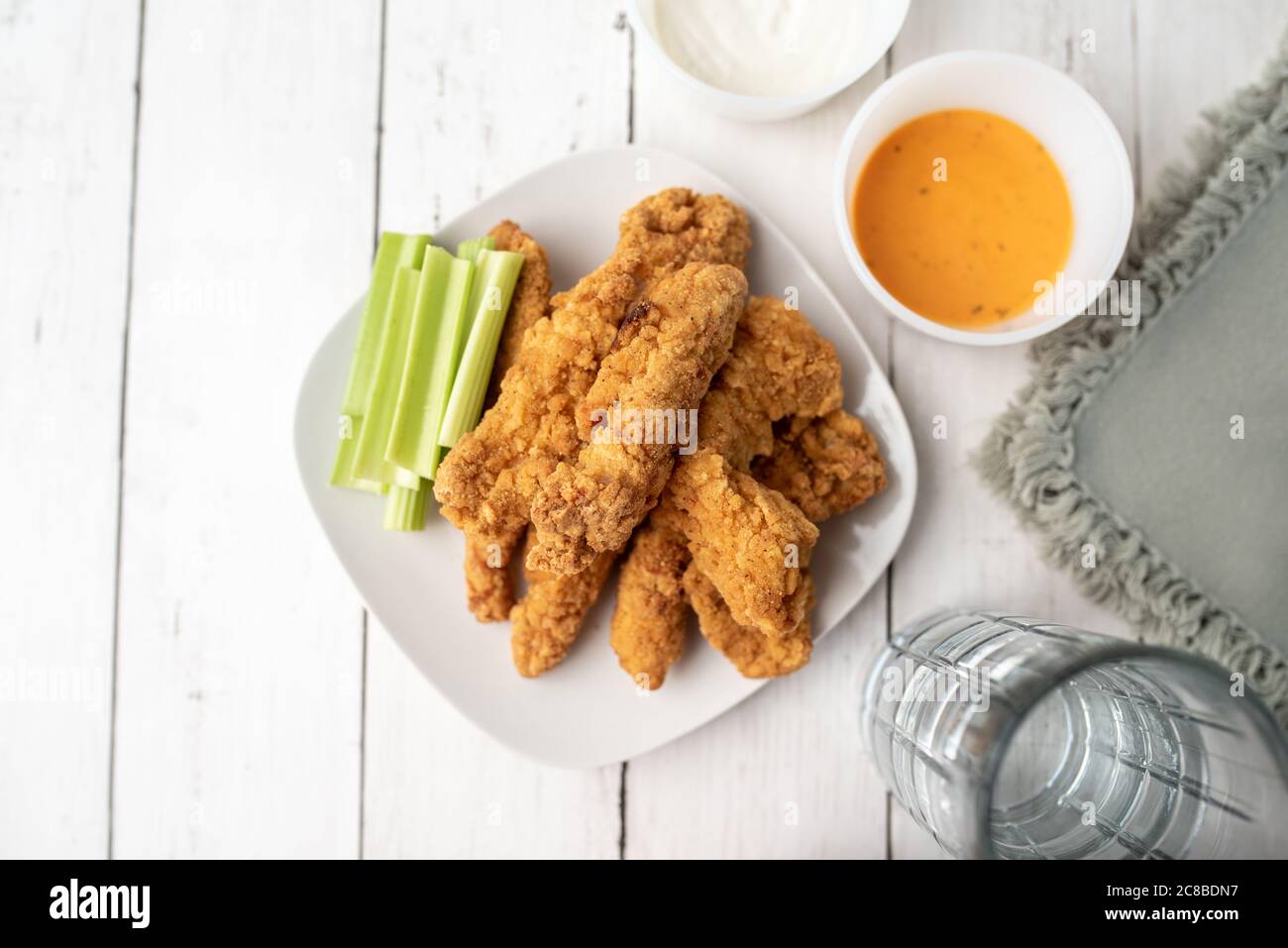 Chicken Fingers dinner, breaded crispy tenders with celery Stock Photo