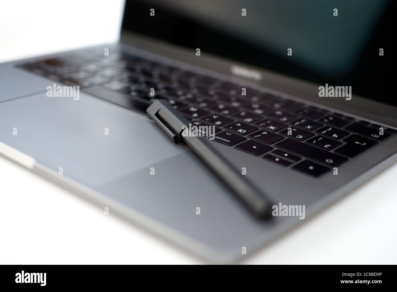 Close-up computer laptop keyboard, pen and pencil Stock Photo - Alamy