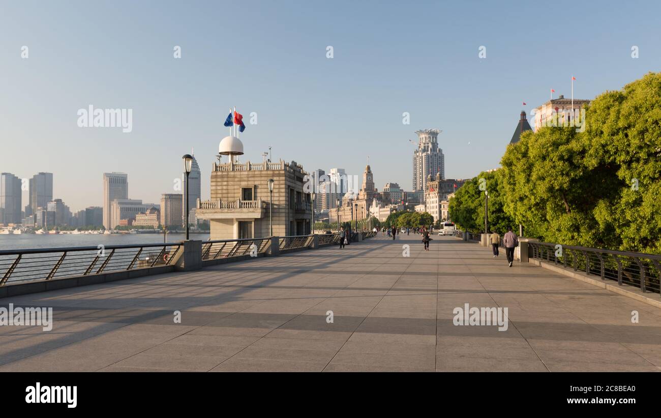 Shanghai, China - April 17, 2018: Panorama of the waterfront promenade at Huangput River. Better known as The Bund (Waitan). Empty, only few people du Stock Photo