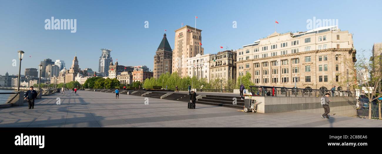 Shanghai, China - April 17, 2018: Panorama of The Bund - waterfront promenade with historical buildings and one of the main attractions of Shanghai. Stock Photo