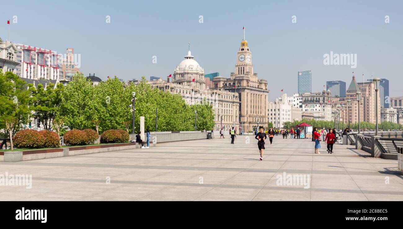 Shanghai, China - April 18, 2018: View along The Bund. Customs House and HSBC Building in the background. Stock Photo