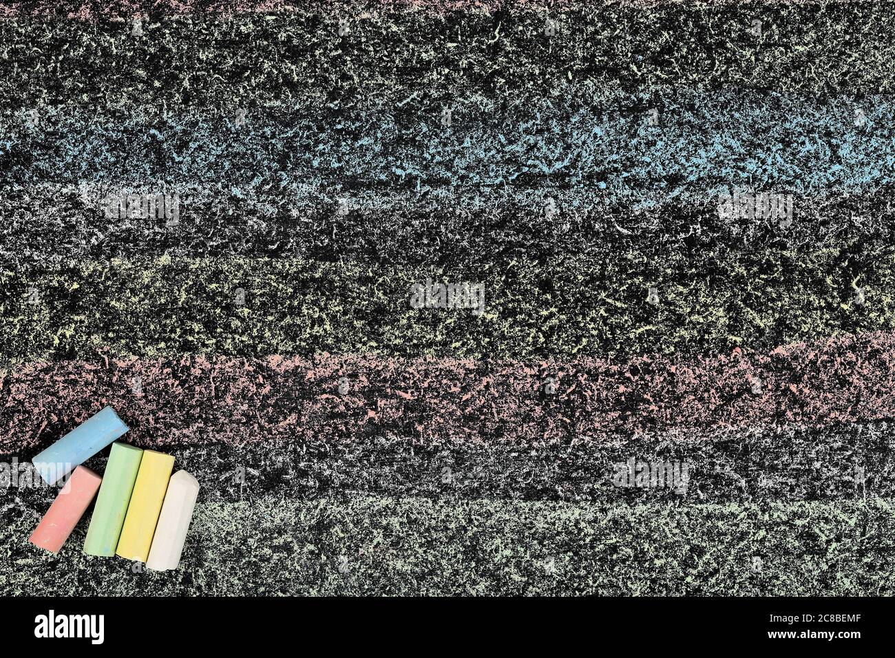 colorful chalkboard with chalk sticks, educational background Stock Photo Alamy