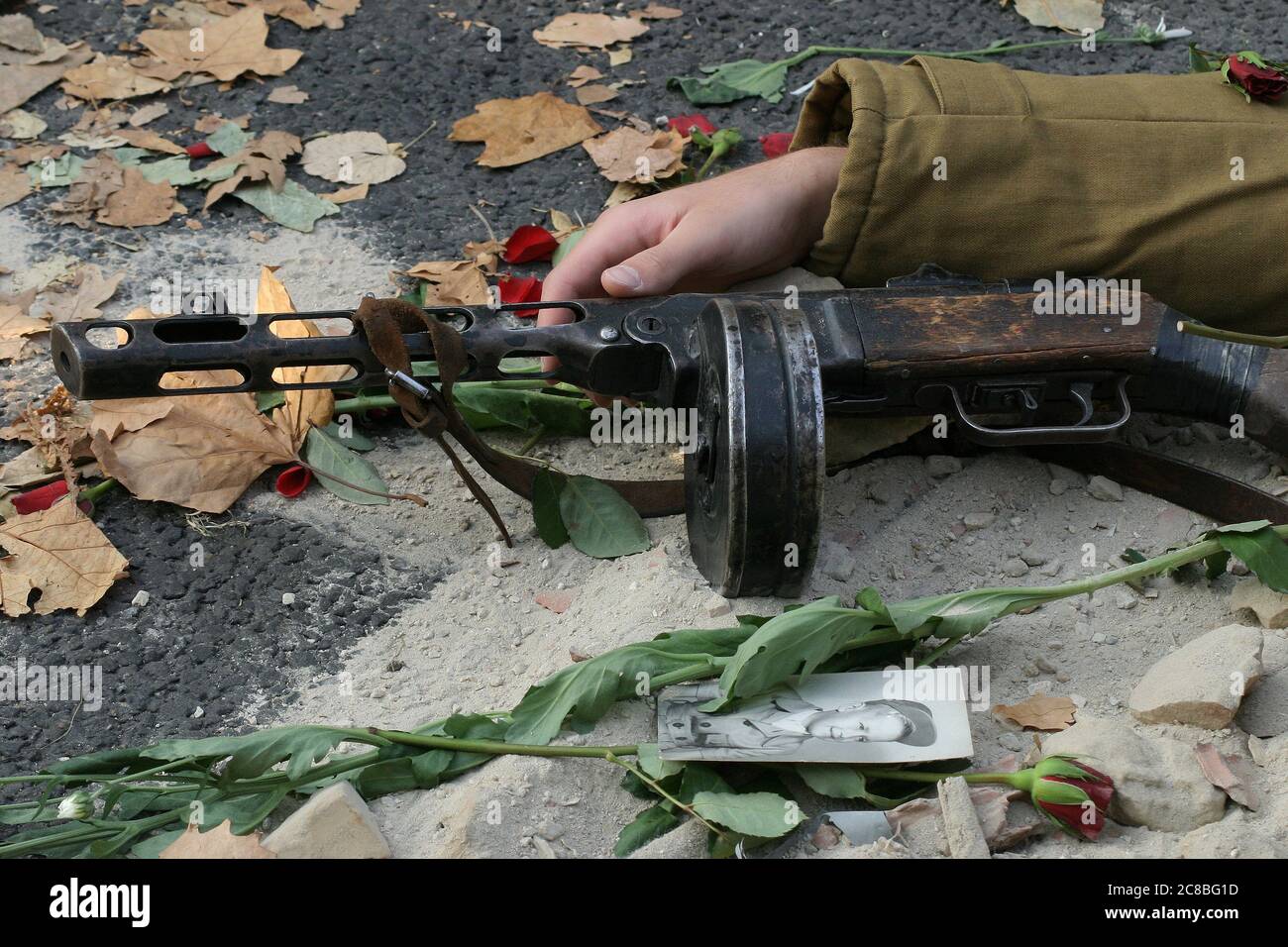 Fallen soldier with drum machine gun Stock Photo Alamy