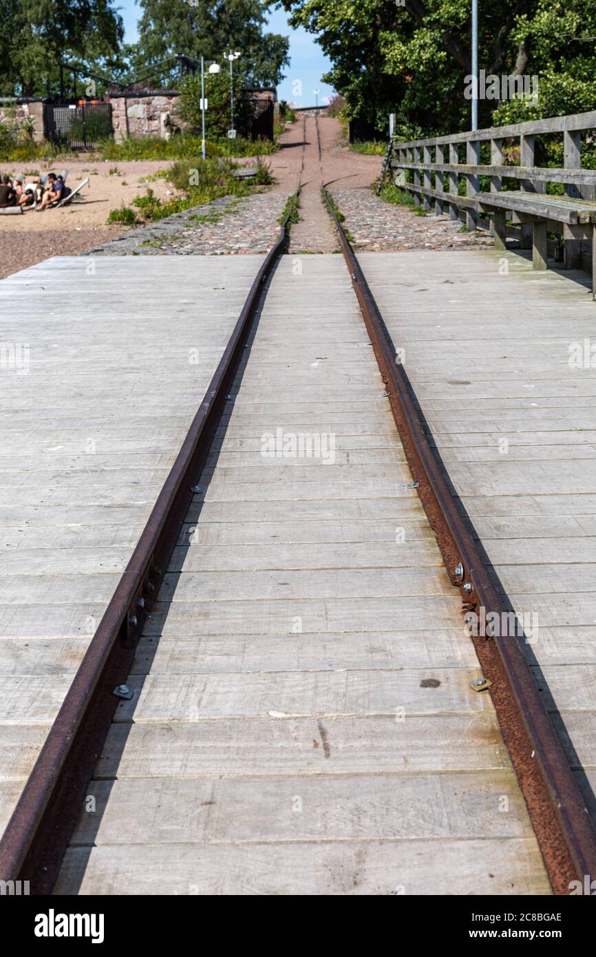 Narrow-gauge railway from jetty to inner parts of Lonna Island in Helsinki archipelago, Finland Stock Photo