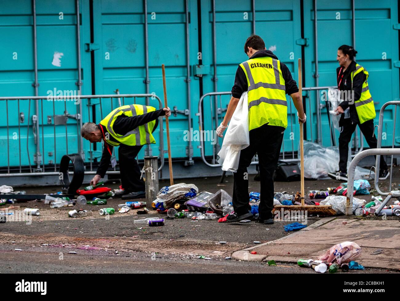 Rubbish is cleaned up outside Anfield following celebrations last night