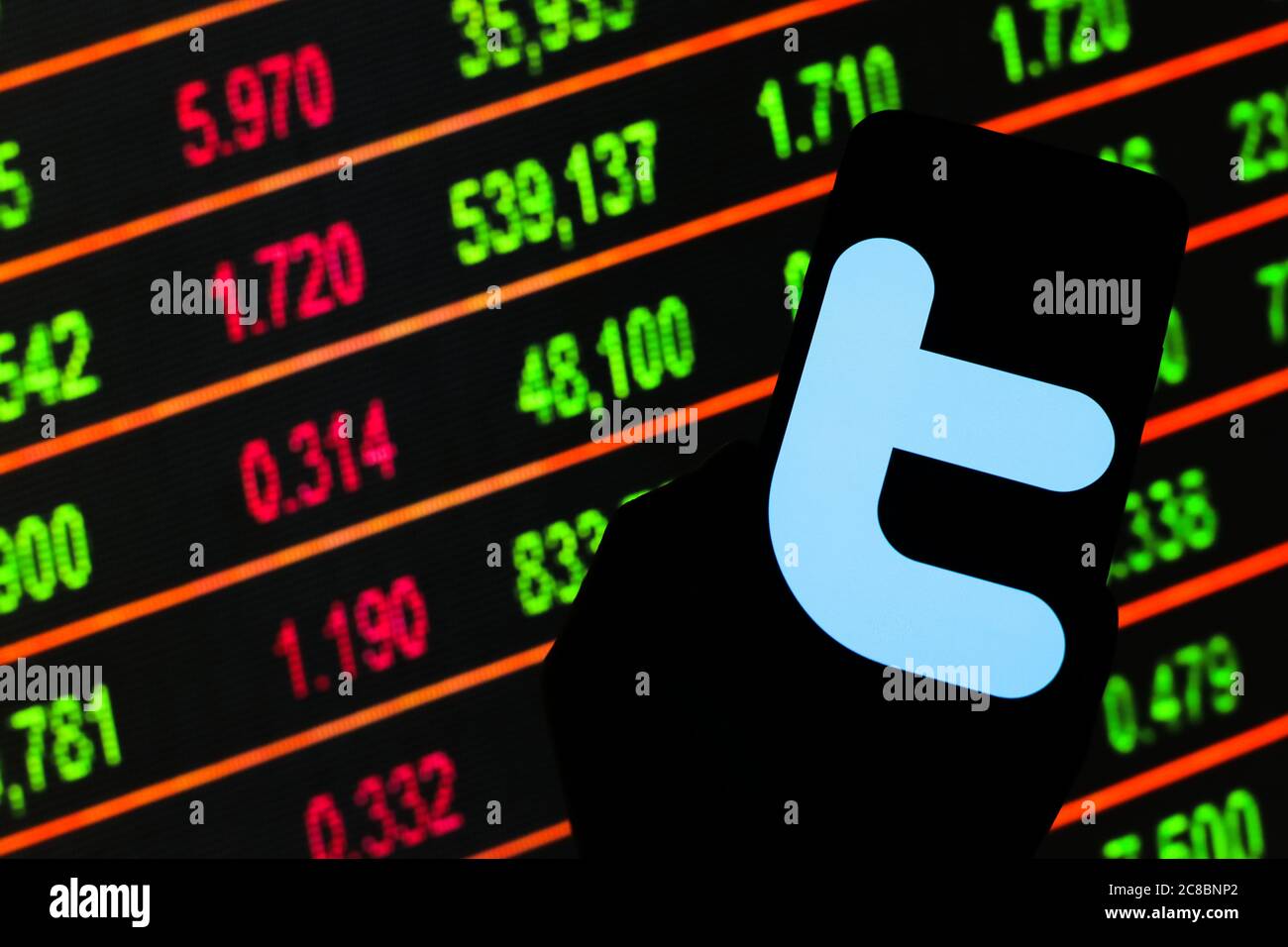 In this photo illustration a Twitter logo seen displayed on a