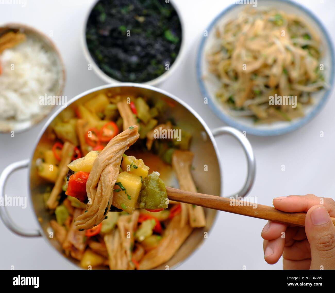 Vietnamese vegan food for vegetarian, woman hand hold pan tofu skin