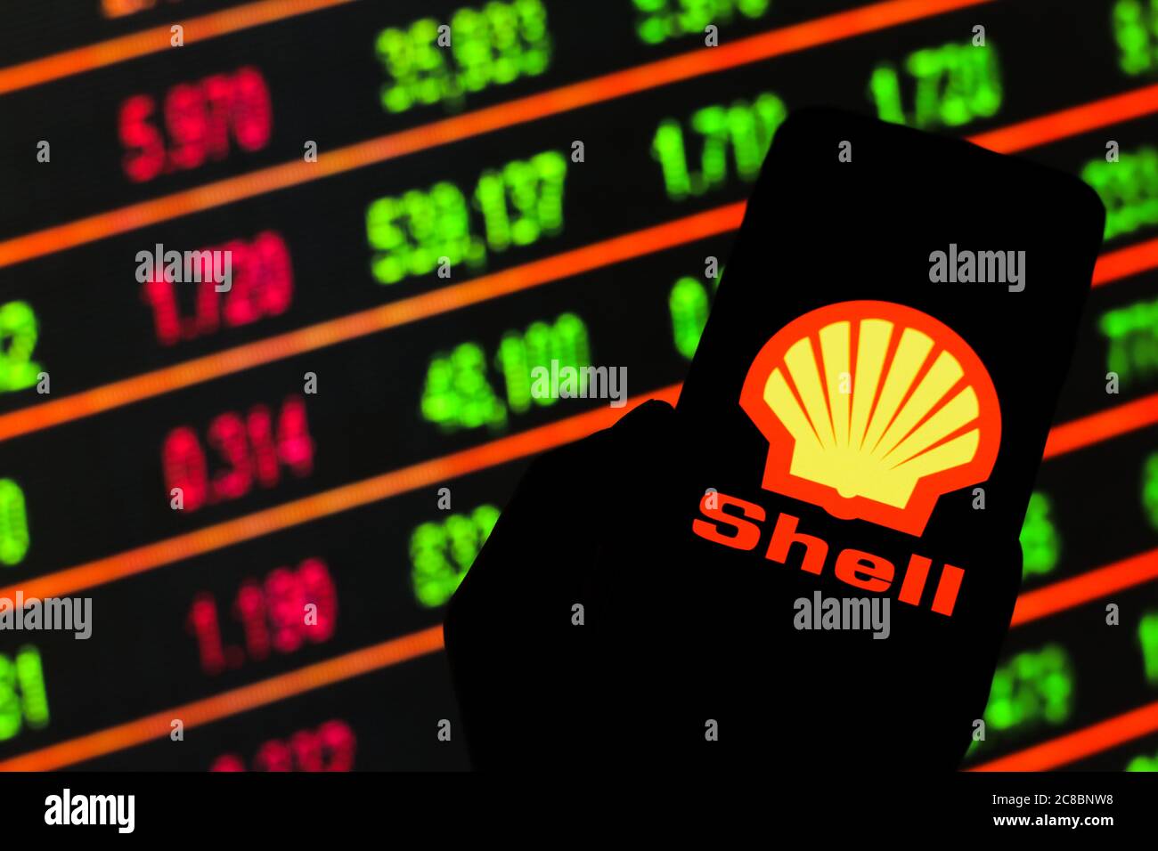 In this photo illustration a Shell logo seen displayed on a smartphone ...