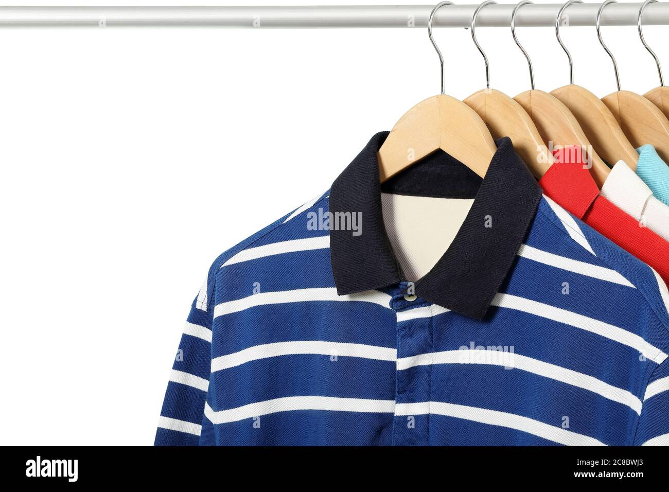 colorful polo shirts on hangers isolated Stock Photo Alamy