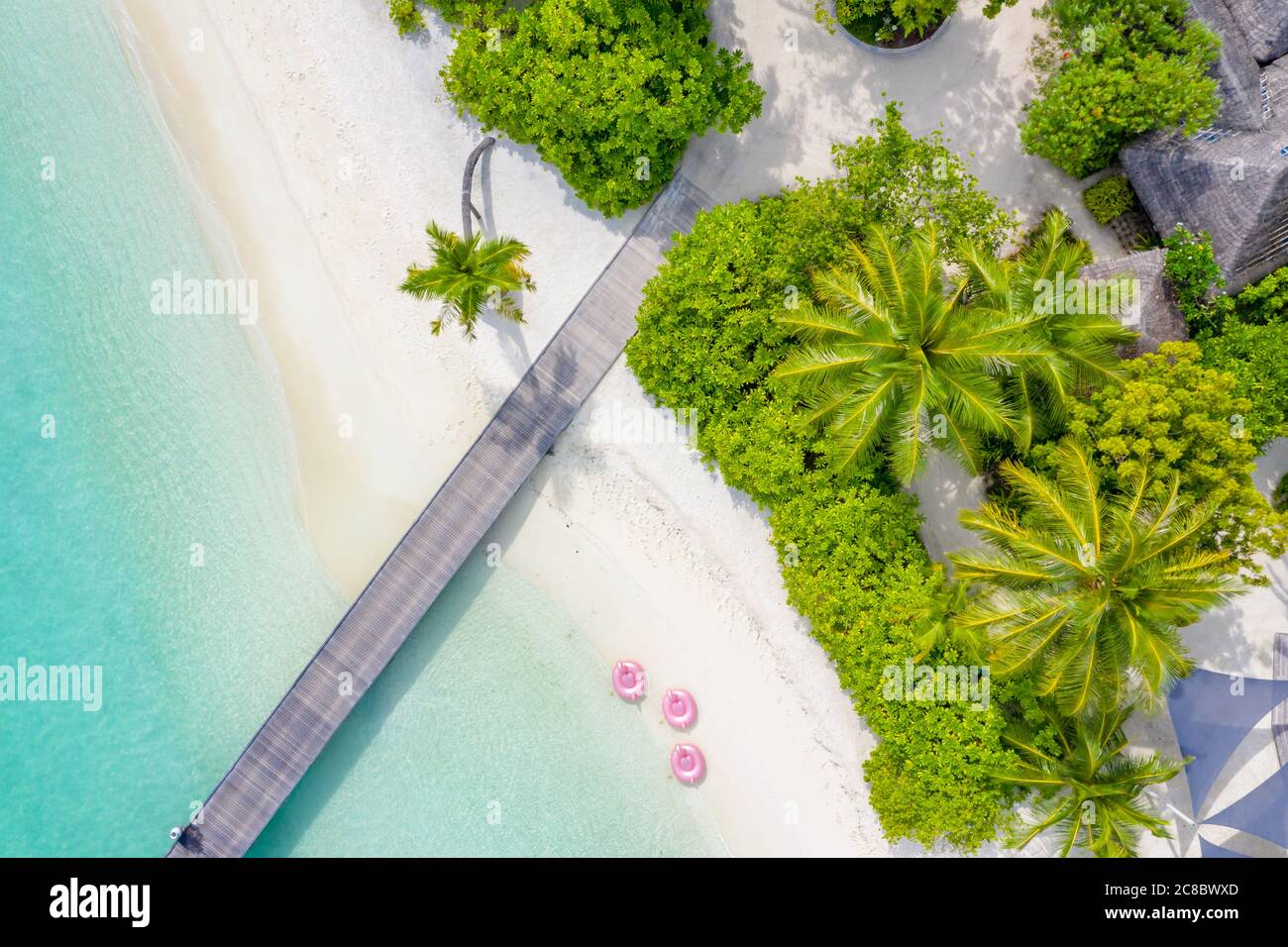 Perfect aerial landscape, luxury tropical resort or hotel with water villas and beautiful beach scenery. Amazing bird eyes view in Maldives, landscape Stock Photo