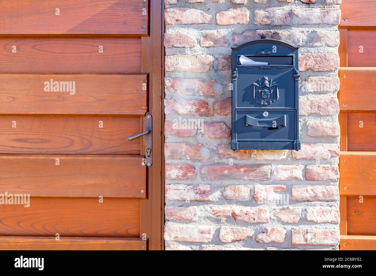 Brown mailbox on brick wall, vintage mailbox style Stock Photo Alamy