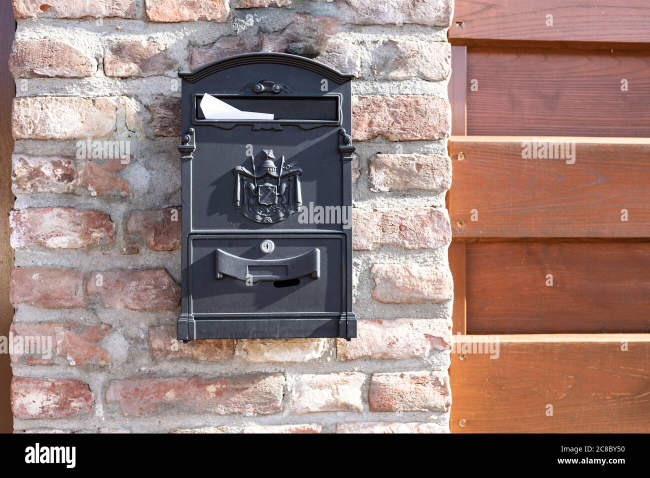 Brown mailbox on brick wall, vintage mailbox style Stock Photo Alamy