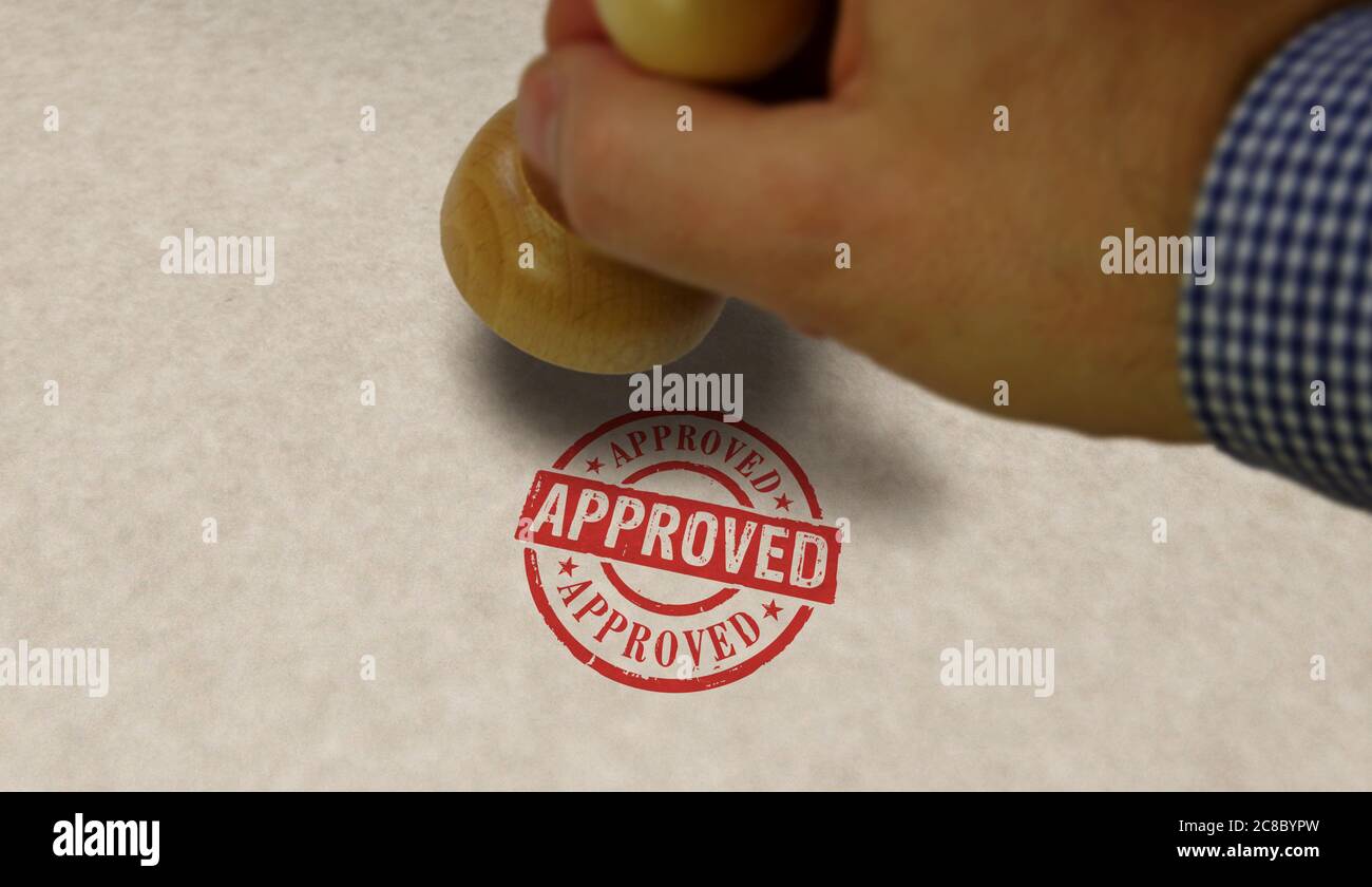 Approved stamp and stamping hand. Found, accepted, admitted and success concept. Stock Photo